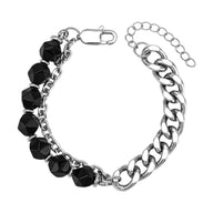 Bracelet homme acier inoxydable argenté avec chaîne cubaine et perles noires facettées, fermoir mousqueton réglable.