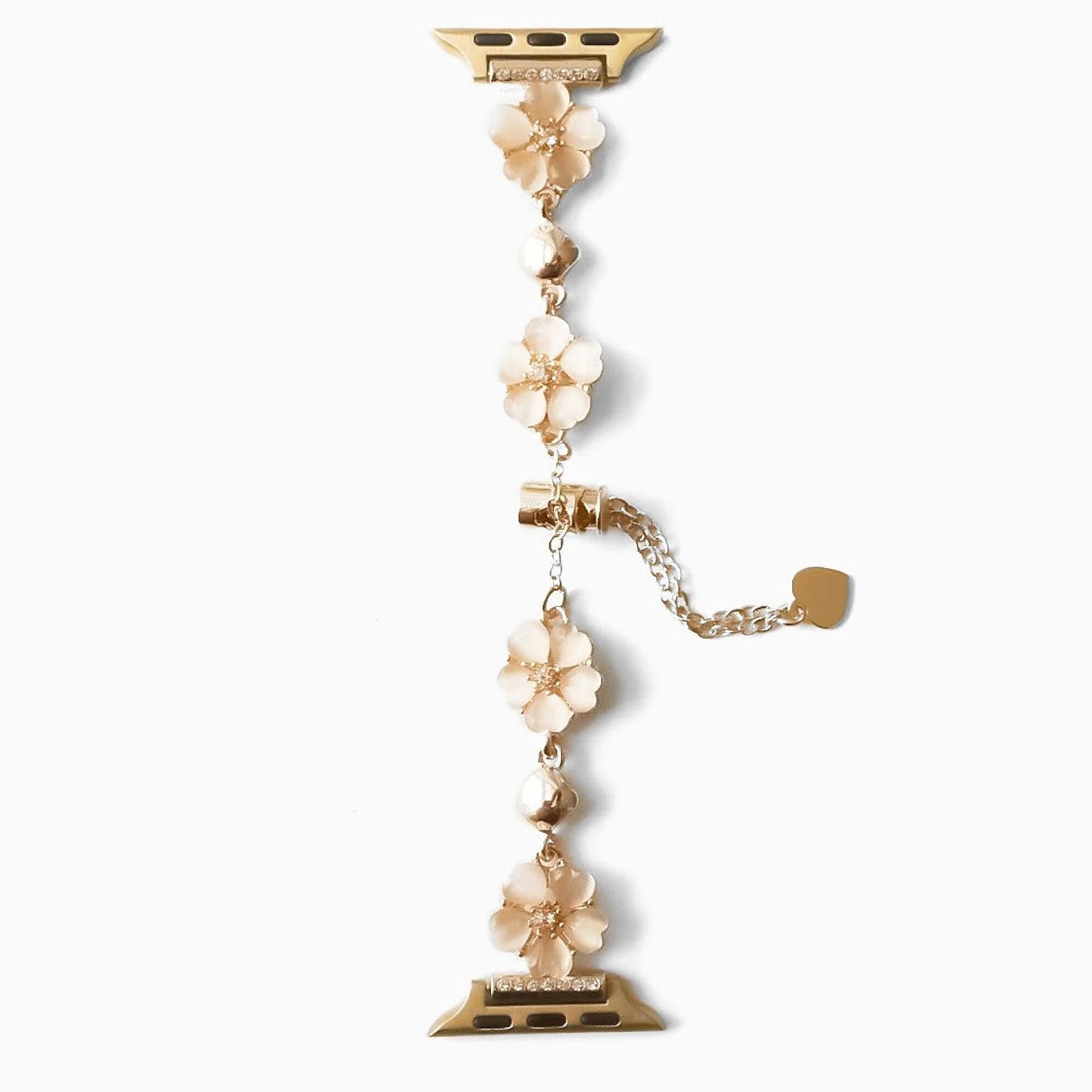 Bracelet chaîne en métal doré avec fleurs de cerisier blanches élégantes pour Apple Watch.
