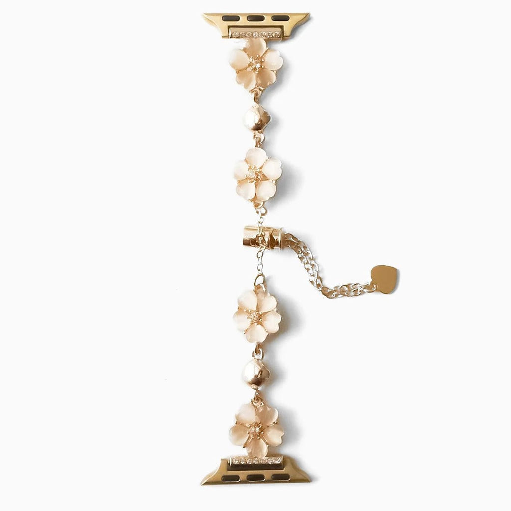 Bracelet chaîne en métal doré avec fleurs de cerisier blanches élégantes pour Apple Watch.