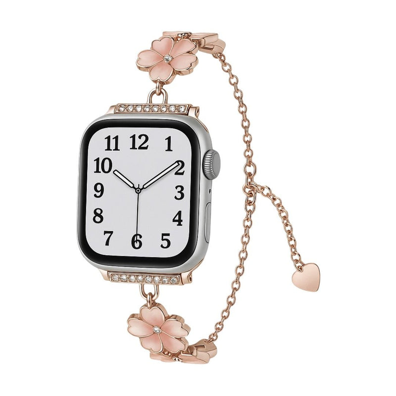 Bracelet chaîne doré rose pour Apple Watch avec fleurs de cerisier féminines en métal et détail cœur suspendu.