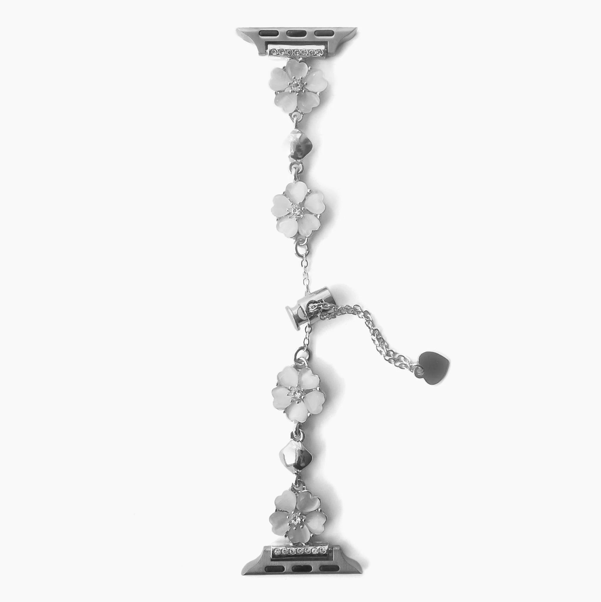 Bracelet chaîne en métal argenté avec fleurs de cerisier stylisées pour Apple Watch, design délicat et féminin.