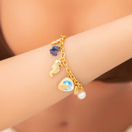 Bracelet charms marins, en acier inoxydable, perles et coquillages, pour femme, modèle Uru - La Boutique du Bracelet