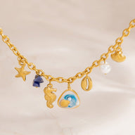 Bracelet charms marins, en acier inoxydable, perles et coquillages, pour femme, modèle Uru - La Boutique du Bracelet