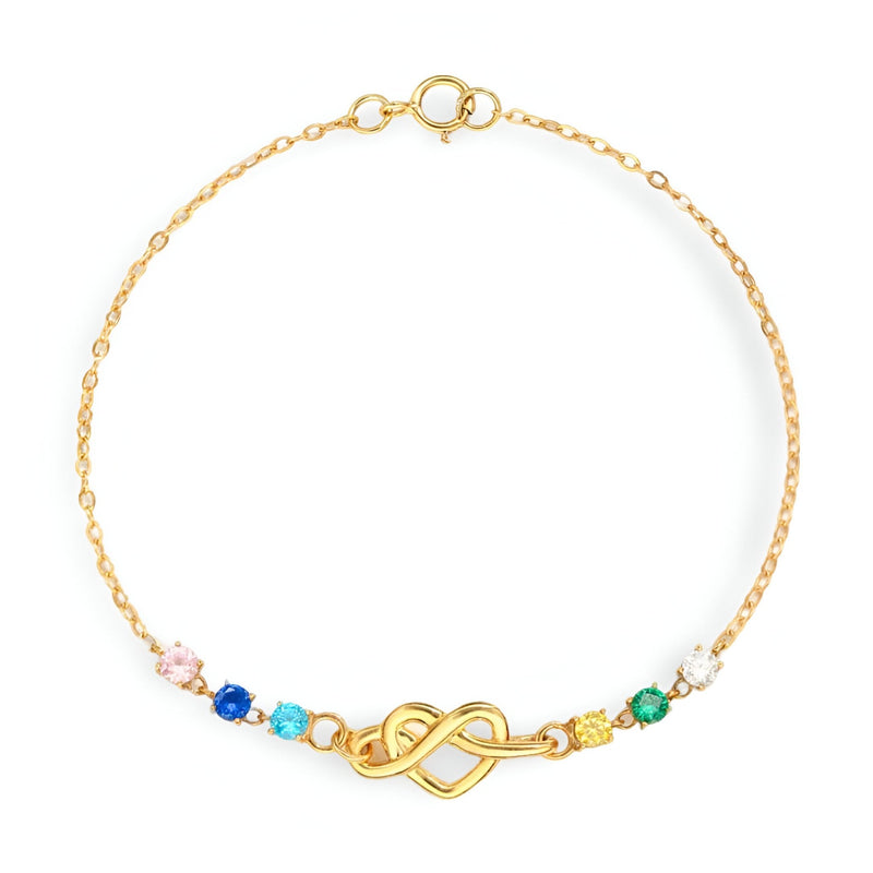 Bracelet fin en or avec cœur emmêlé et perles colorées sur chaîne délicate.