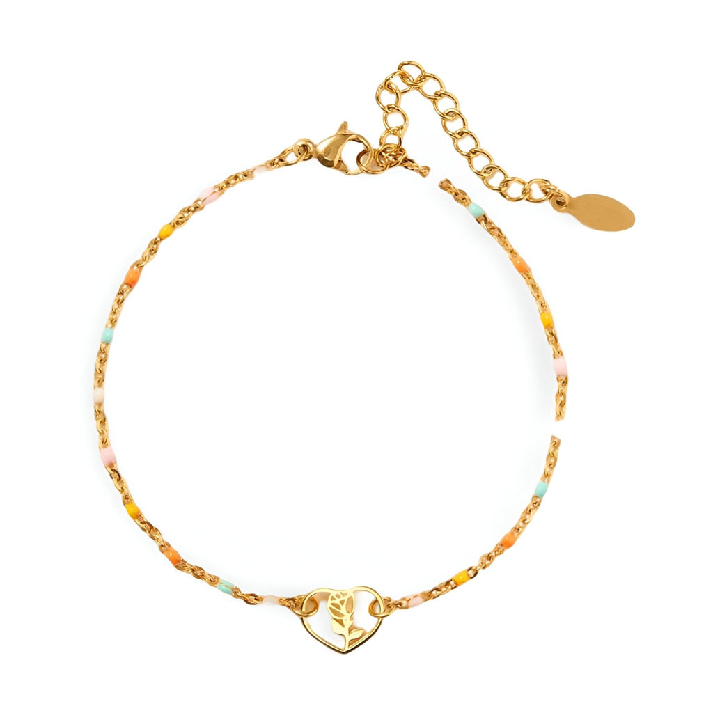 Bracelet fin en or avec pendentif cœur ajouré orné d'une rose délicate.