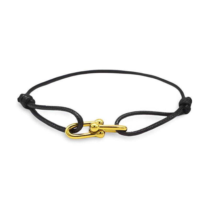 Bracelet cordon noir avec fermoir à maillons dorés croisés modèle Verity.