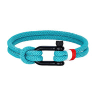 Bracelet cordon turquoise avec manille noire et détail rouge et blanc en tissu tressé.