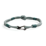 Bracelet cordon turquoise avec nœud et mousqueton métallique noir mat, style Parker pour homme.