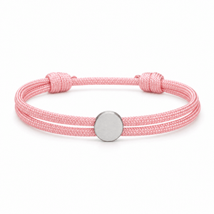 Bracelet Marsin Rose et argent, cordon ajustable et pastille ronde, posé de face sur fond blanc