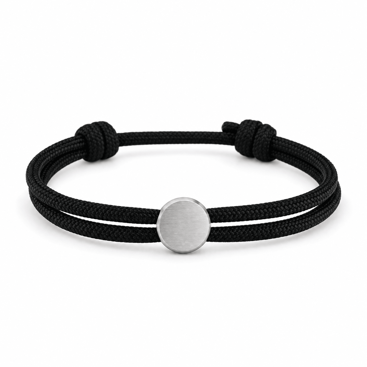 Bracelet Marsin Noir et argent, cordon ajustable et pastille ronde, posé de face sur fond blanc