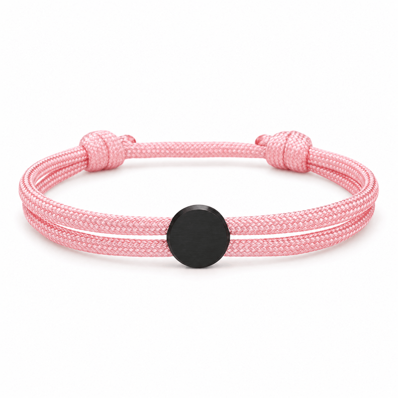 Bracelet Marsin Rose et noir, cordon ajustable et pastille ronde, posé de face sur fond blanc