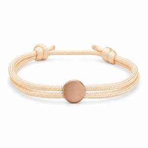 Bracelet Marsin Blanc crème et or rosé, cordon ajustable et pastille ronde, posé de face sur fond blanc