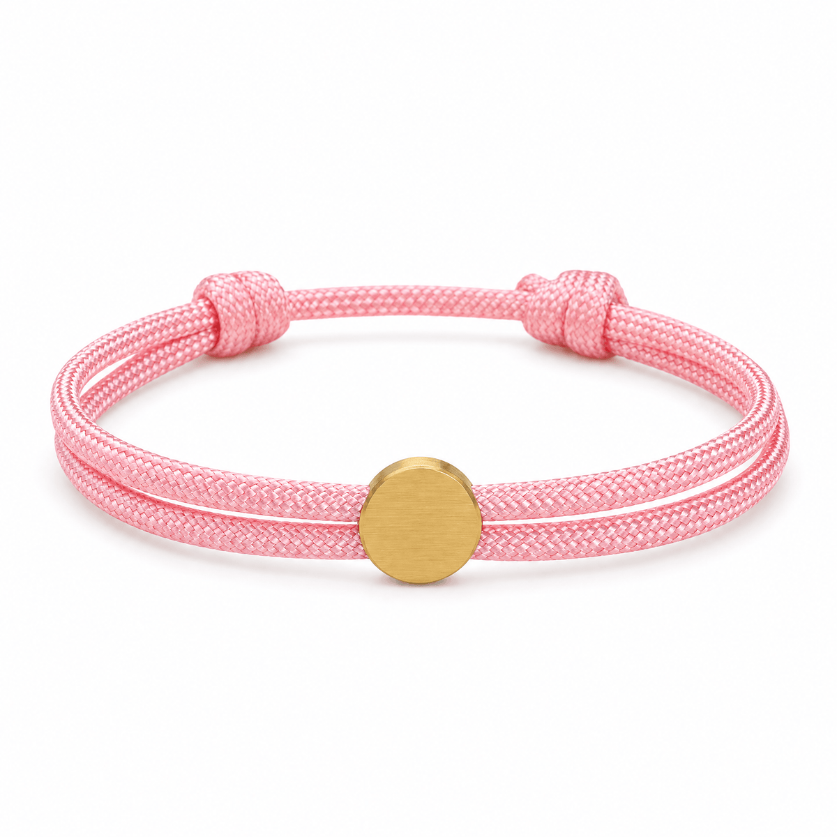 Bracelet Marsin Rose et or, cordon ajustable et pastille ronde, posé de face sur fond blanc