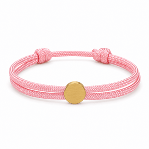 Bracelet Marsin Rose et or, cordon ajustable et pastille ronde, posé de face sur fond blanc