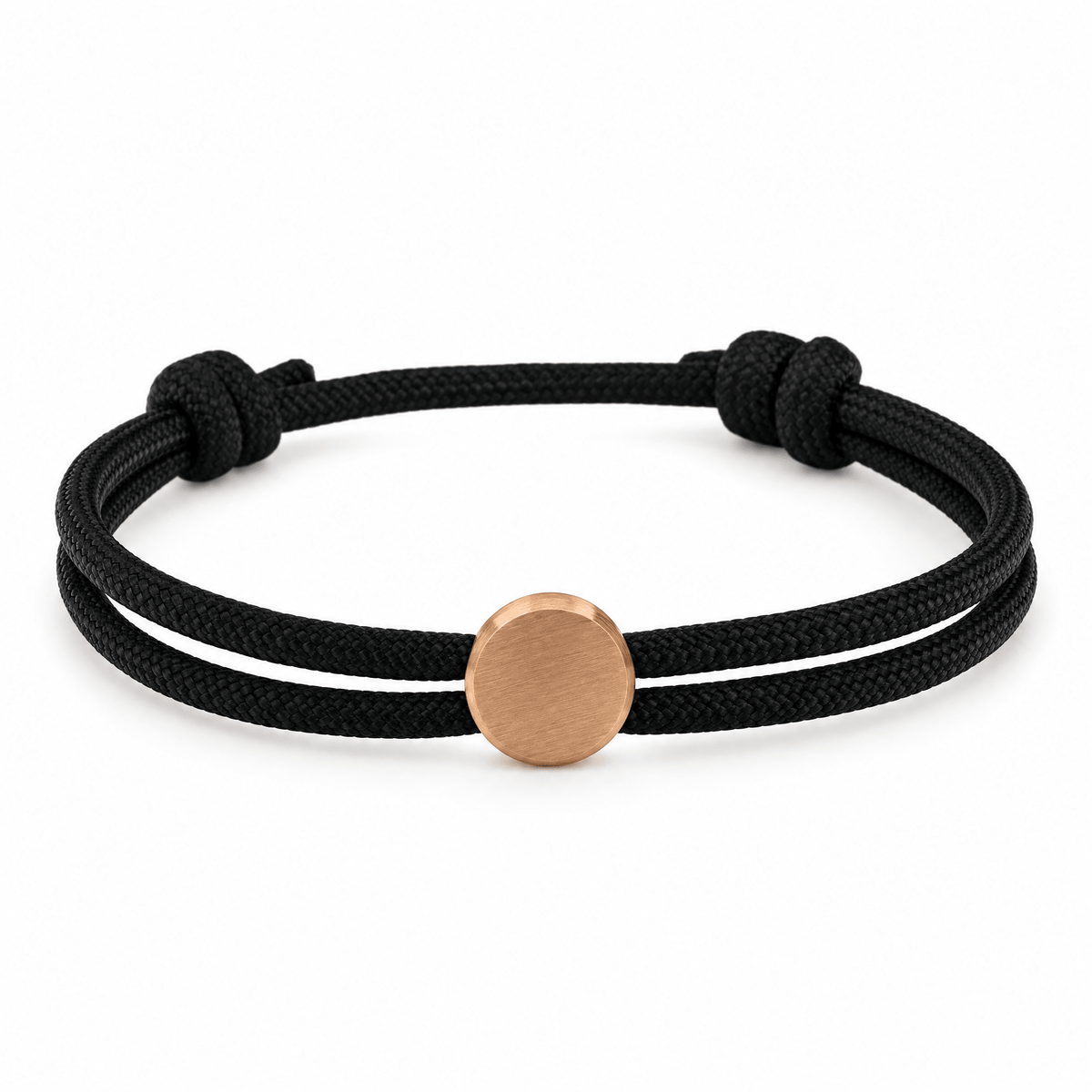 Bracelet Marsin Noir et or rosé, cordon ajustable et pastille ronde, posé de face sur fond blanc