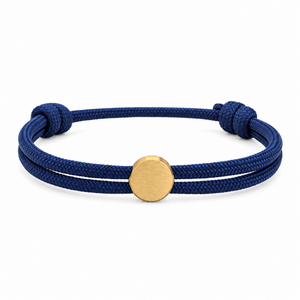 Bracelet Marsin Bleu marine et or, cordon ajustable et pastille ronde, posé de face sur fond blanc