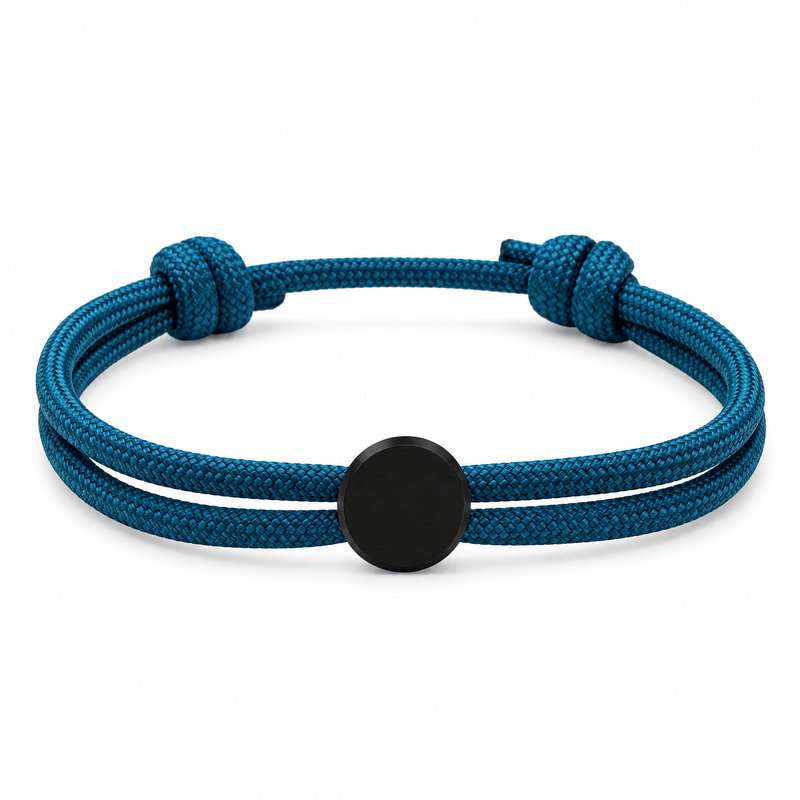 Bracelet Marsin Bleu et noir, cordon ajustable et pastille ronde, posé de face sur fond blanc