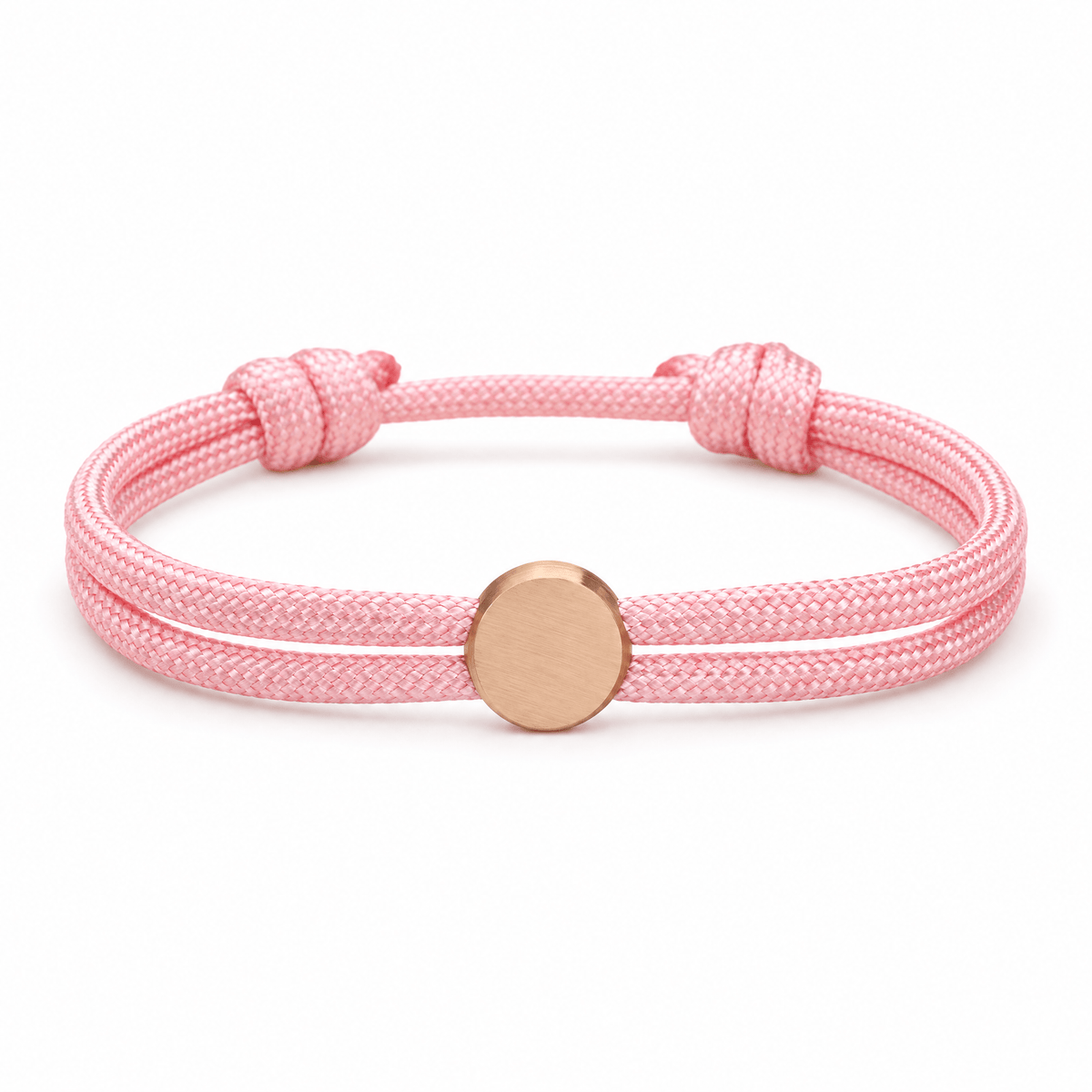 Bracelet Marsin Rose et or rosé, cordon ajustable et pastille ronde, posé de face sur fond blanc