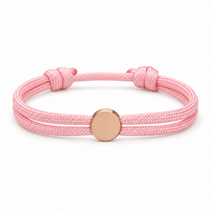 Bracelet Marsin Rose et or rosé, cordon ajustable et pastille ronde, posé de face sur fond blanc