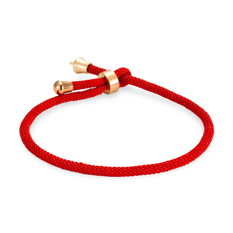 Bracelet cordon rouge minimaliste avec détails en titane plaqué or, modèle Frémi.