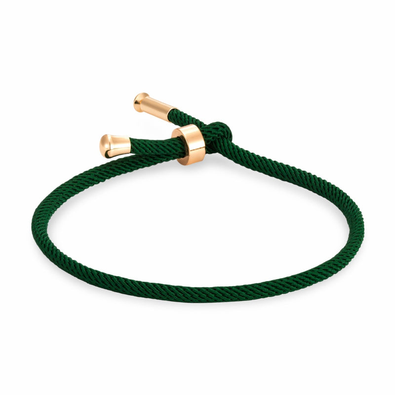 Bracelet cordon vert foncé avec détails en titane plaqué or, modèle Frémi minimaliste.