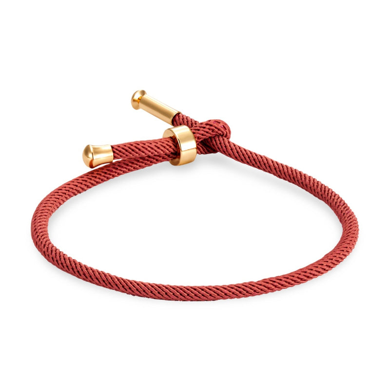 Bracelet cordon rouge avec détails en titane plaqué or minimaliste modèle Frémi.