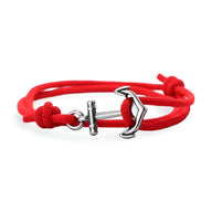 Bracelet cordon rouge avec ancre marine en métal argenté et fermoir coulissant.