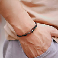 Bracelet cordon vert foncé avec ancre marine en métal, style masculin et coulissant.