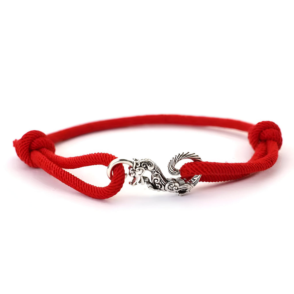 Bracelet cordon rouge coulissant avec pendentif dragon en métal argenté pour homme.