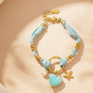 Bracelet cordon d'amour, aux multiples charms dorés, en acier inoxydable, pour femme, modèle Lalama - La Boutique du Bracelet