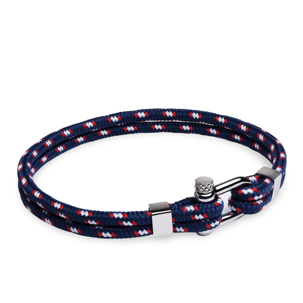 Bracelet cordon double bleu marine à motifs blancs et rouges avec mousqueton en acier inoxydable.