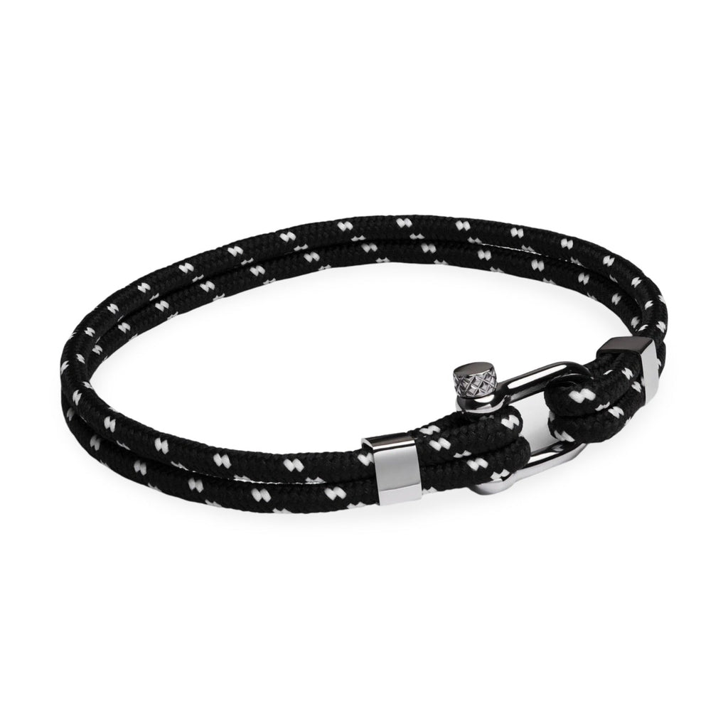 Bracelet cordon noir à motifs blancs, double boucle et mousqueton en acier inoxydable brillant.
