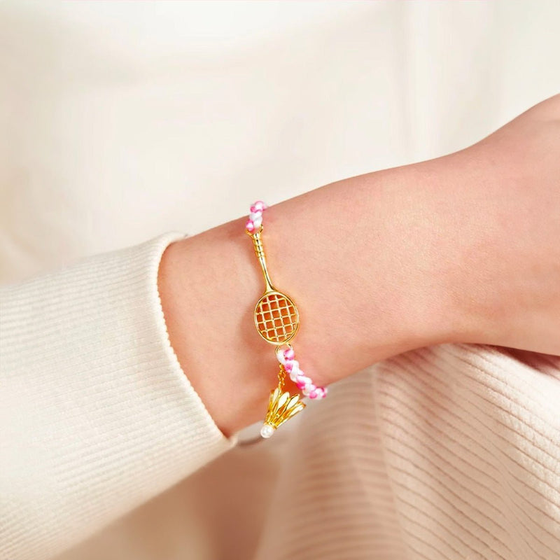 Bracelet cordon rose avec pendentif acier inoxydable en forme de raquette de badminton.