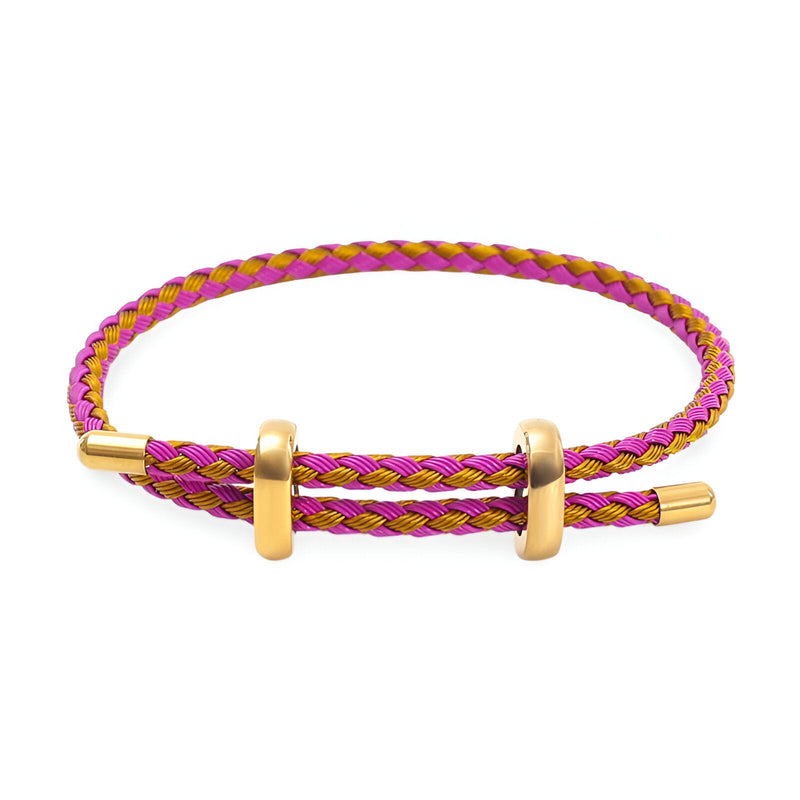 Bracelet cordon rose et jaune tressé avec fermoir et anneaux en acier inoxydable doré.