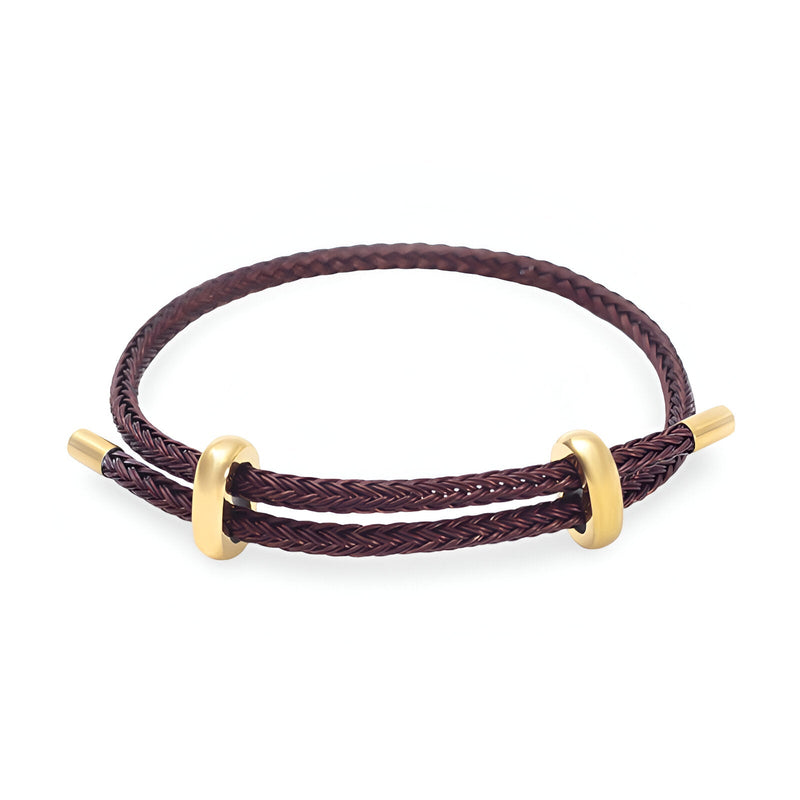 Bracelet cordon marron tressé avec éléments en acier inoxydable doré, style authentique.