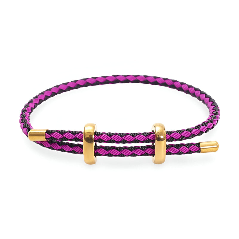 Bracelet cordon tressé rose et noir avec fermoir et anneaux dorés en acier inoxydable.