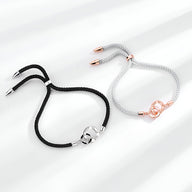 Bracelet cordon noir avec détail en argent sterling et bracelet gris avec détail en or rosé, modèle mixte Fay.