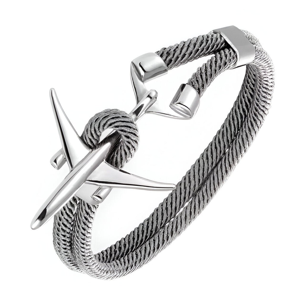 Bracelet cordon bleu torsadé avec avion en acier inoxydable poli et fermoir minimaliste.