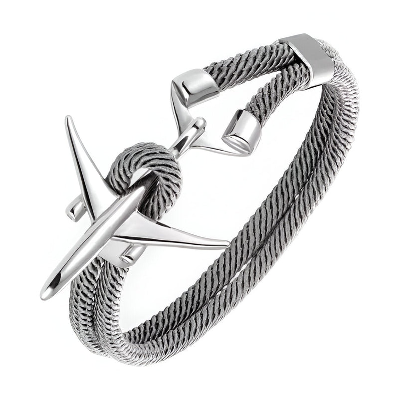 Bracelet cordon bleu torsadé avec avion en acier inoxydable poli et fermoir minimaliste.