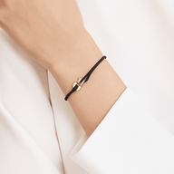Bracelet cordon noir avec fer à cheval en acier inoxydable couleur or rosé, modèle Lanfeust.