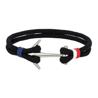 Bracelet cordon noir tressé, ancre acier inoxydable, détails bleu et rouge, ajustable.