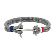 Bracelet cordon marin gris à ancre en acier inoxydable avec nœuds bleu et rouge, ajustable.