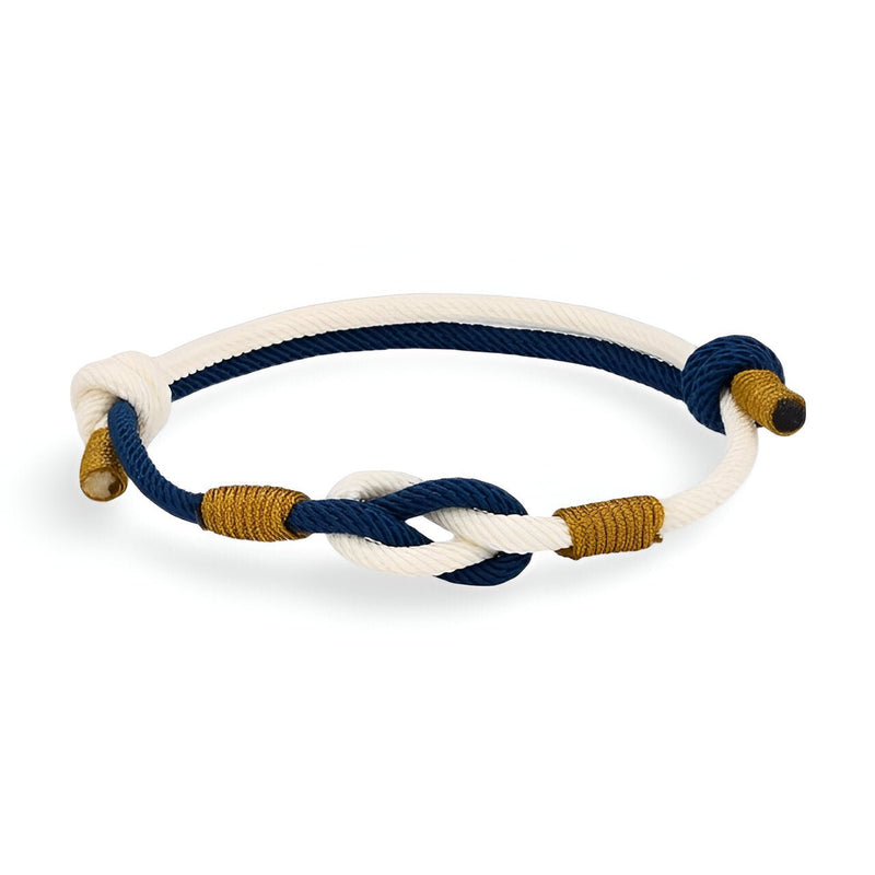 Bracelet cordon bi-couleur bleu et blanc avec nœud central et finitions dorées.
