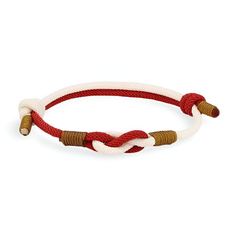 Bracelet cordon bi-colore rouge et blanc avec noeud central et détails marron.