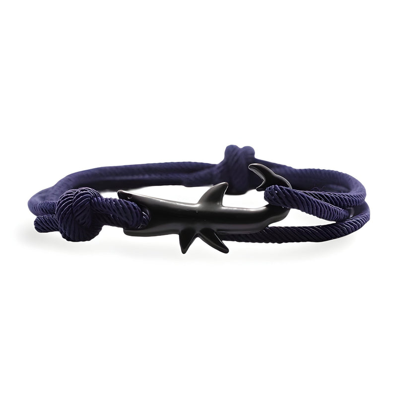 Bracelet cordon bleu marine avec motif requin noir en métal, style marin et ajustable.