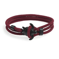 Bracelet cordon bordeaux à motif tortue en métal noir, style marin élégant.