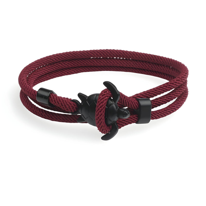 Bracelet cordon bordeaux à motif tortue en métal noir, style marin élégant.