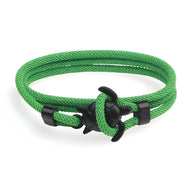 Bracelet cordon vert sapin avec motif tortue noir en métal, style marin ajustable.