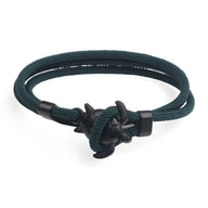 Bracelet cordon vert sapin à motif tortue noir avec fermoir noué élégant.