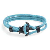 Bracelet cordon turquoise double tour avec motif tortue noir en métal.